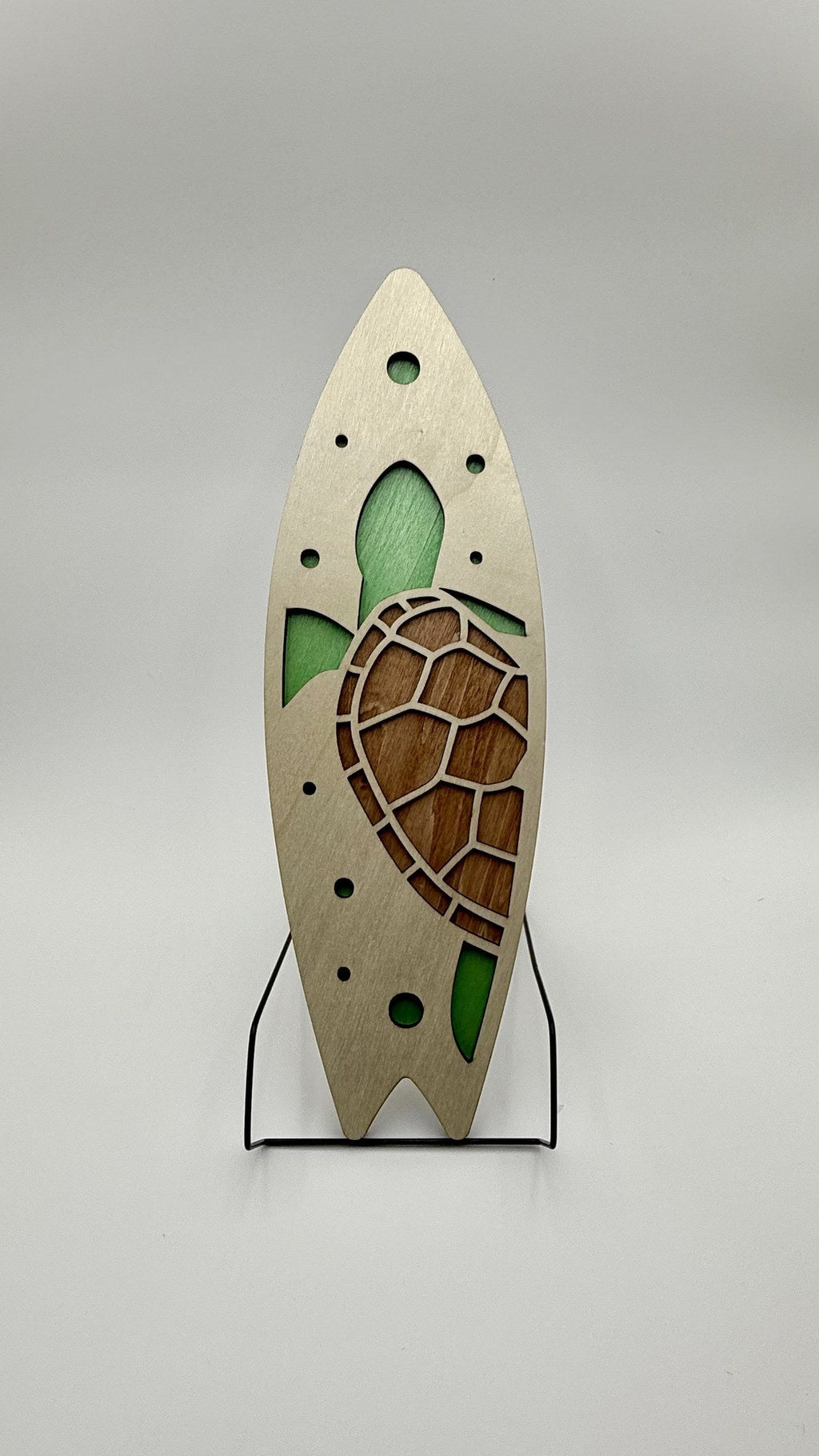 Laser-cut wood sea turtle surfboard wall art with green resin accent by Shoreline Custom Creations