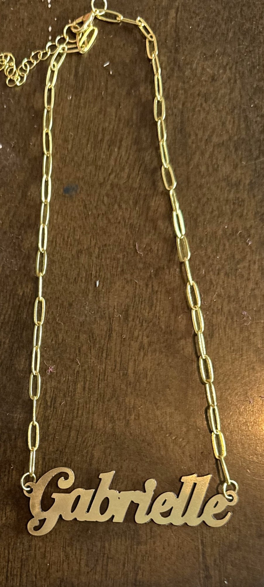 Personalized laser-cut gold nameplate necklace with cursive name by Shoreline Custom Creations
