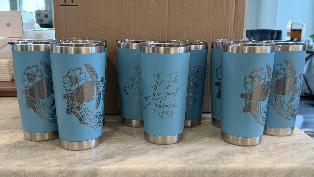 Bulk order of blue laser-engraved hibiscus wave tumblers — perfect for wedding favors and corporate gifts by Shoreline Custom Creations